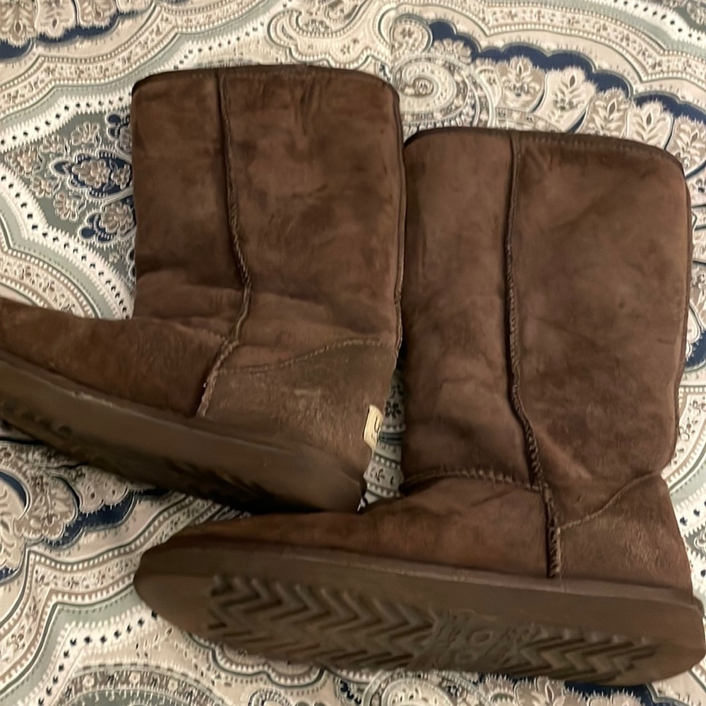 Classic authentic UGG Boots.  13” height.  Warm fleece lining.  Good condition